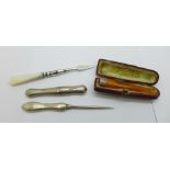 A silver needle case, Chester 1910, a manicure with silver handle, a manicure with mother of pearl