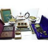 A silver plated three piece tea service, a set of balance scales and weights, an Addmaster adding