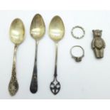 A hallmarked silver Teddy bear, a/f, three silver spoons and two silver rings, a/f, 41.8g