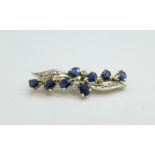 A 9ct gold, sapphire and diamond brooch, 2.4g