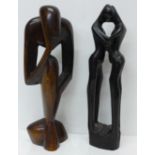 Two carved wooden figures, 31cm