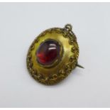 A Victorian yellow metal and cabochon garnet brooch/pendant, (tests as high carat gold), a/f, 4.