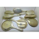 Five silver backed brushes and three silver hand mirrors, (one mirror with many small dents)