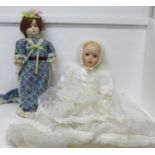 A porcelain head Christening doll and a porcelain head doll and stand