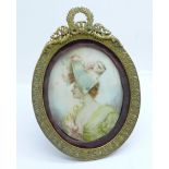 A 19th Century miniature, half portrait watercolour on ivory of a lady wearing a bonnet in an oval
