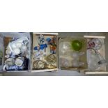 A box of blue and white china, two boxes of glass and a box of Capodimonte style figures, etc. **