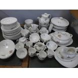 A large collection of Royal Doulton Tumbling Leaves pattern tea and dinnerware, including three