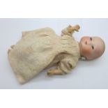 A small Armand Marseille doll, 3N 1310 K, head detached