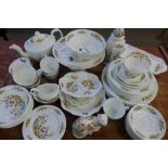 A collection of Aynsley Cottage Garden tea and dinnerware, tea pot, cream, sugar, seven cups,