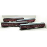 Four Hornby OO gauge railway carriages, LMS red