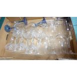 Two boxes of crystal drinking glasses, four wine glasses with blue stems, crystal decanter with