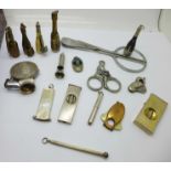 A collection of fourteen cigar cutters; four silver including an owl, four novelty bottles,