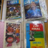 Two albums of football programmes including F.A. Cup finals, international and league clubs
