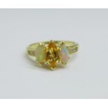 A silver gilt, welo opal and citrine ring, V