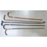 Five walking sticks with silver embellishments