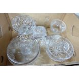 A collection of crystal and glass, a small jug, salad bowl and servers, a heavy cut glass bowl,