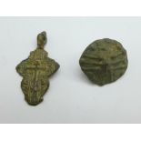 A Viking cross and cloak button, found in Russia