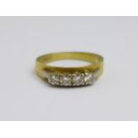 An 18ct gold and four stone diamond ring, 3.7g, P/Q