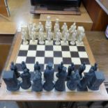 A Camelot Reformation chess set and board