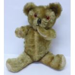 A Le-Fray Limited musical Teddy bear with jointed limbs and glass eyes, 41cm (music box not