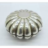 A 19th Century continental white metal box with fluted detail, two marks on the inner rim,