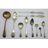 A collection of silver spoons including a Victorian ladle by George Adams and other 19th Century,