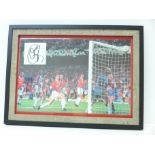 A framed photograph of the 1999 Champions League Final, Manchester United's winning goal with