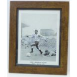 A framed signed black and white print of Jimmy Greaves playing for Tottenham versus Arsenal