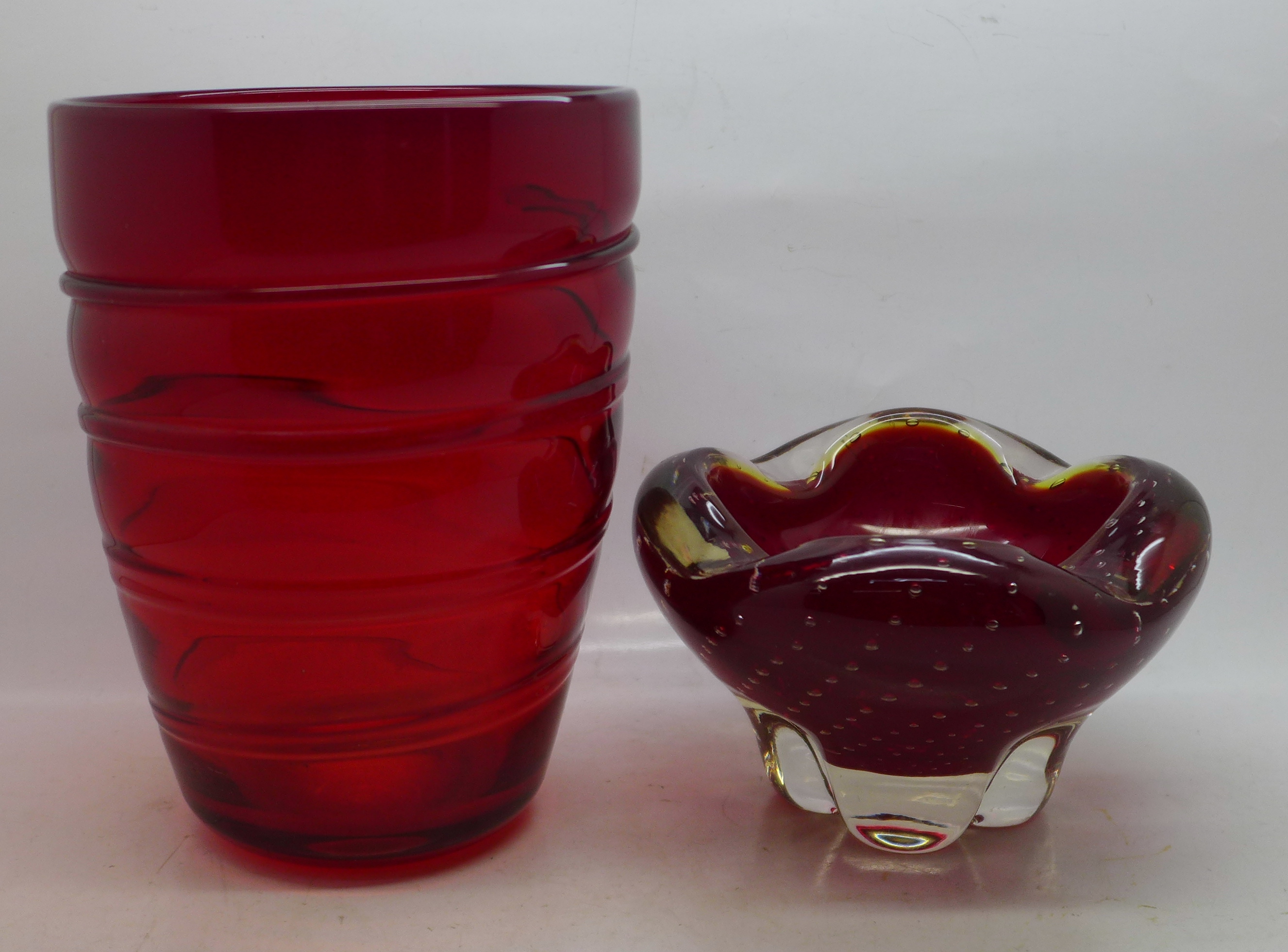 A Whitefriars ruby red glass controlled bubble bowl and a red glass vase