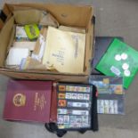 A box of stamps, Republic of China and Singapore mint stamps, packs of blank album leaves and