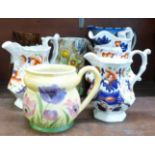 A brown bargeware jug, dated 1881, a Radford tulip jug, a Radford anemone jug, three Gaudy Welsh