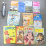 A collection of Ordnance Survey maps, children's books including Rupert, Judy and Bunty and a Pyrene