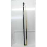 A Ronnie O'Sullivan snooker cue in a metal tube