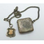 A silver vesta case and a silver double Albert chain with silver fob, total weight 57g, chain