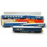 Three Tri-ang Pullman locomotives and two Tri-ang carriages, R.426 and R.556, boxed