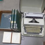 An Adler Gabriele 25 typewriter, an empty carte de visite album and a set of books, Outline of