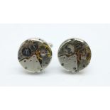 A pair of novelty watch movement cufflinks