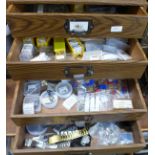A four drawer chest of watch parts, ETA, AS, ESA, FHF blister packs, bracelet parts, Harley,
