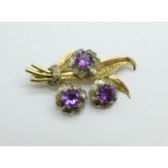 A 9ct gold and purple stone flower brooch, 5.1g