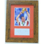 A framed A4 photograph of England captain Martin Johnson holding the 2003 Rugby World Cup with