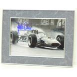 A framed signed photograph of the ex-F1 driver Jackie Stewart