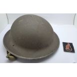 A British WWII helmet and a Desert Rat uniform patch