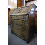 A carved Ipswich oak bureau, 98cms h, 76cms w, 40cms d