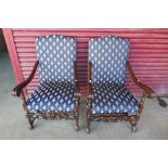 A pair of French carved mahogany and upholstered fauteuils