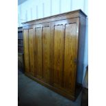 A Victorian pitch pine three door wardrobe, 199cms h, 210cms w, 52cms d