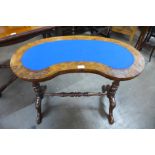 A Victorian inlaid walnut kidney shaped writing table, 69cms h x 87cms w