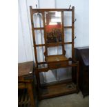 An Arts and Crafts oak hallstand, 195cms h x 91cms w