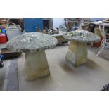 A pair of reconstituted stone and concrete garden staddle stones, 58cms h