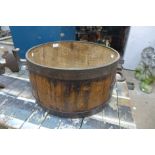 A coopered oak barrel shaped planter