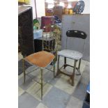 An industrial machinist's chair and a brass chair